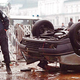 D.C. police officials examine the automobile overturned by the nation’s highest court Sunday.